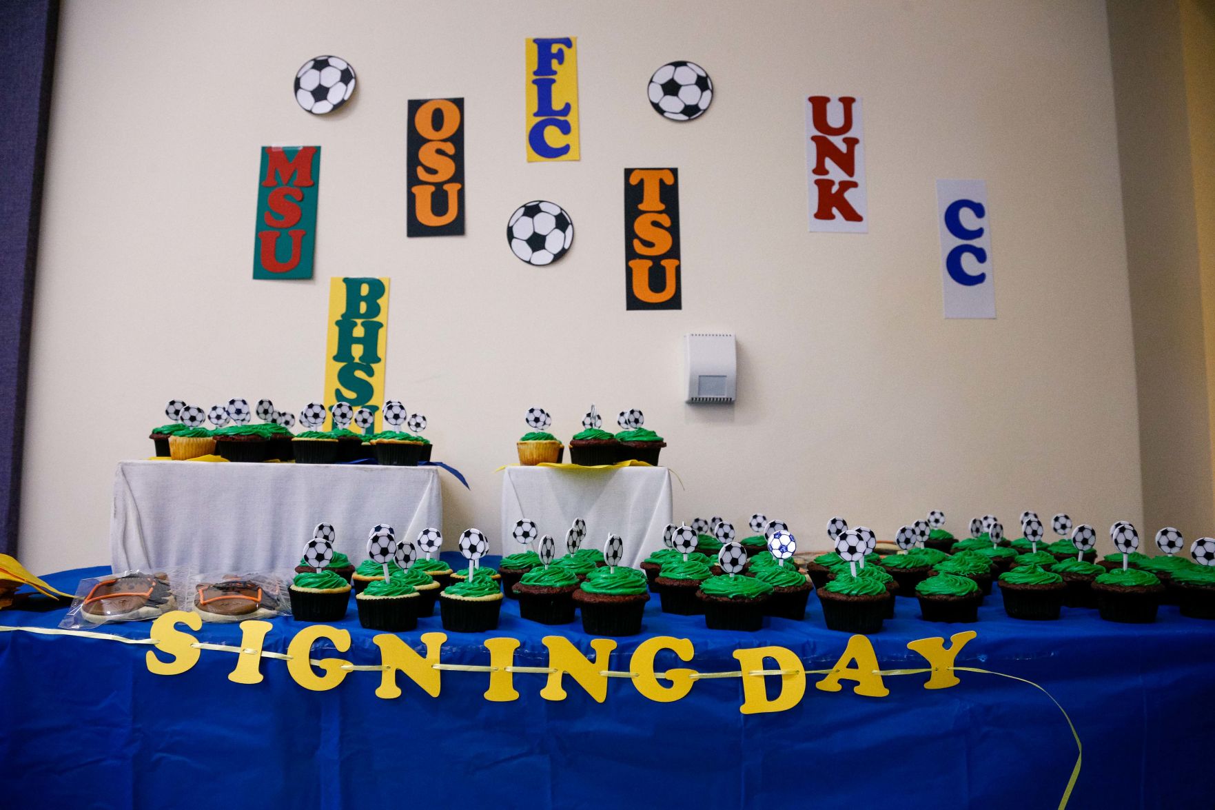 SIGNING DAY: Rampart athletes sign their National Letter of Intent